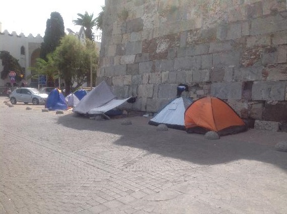 Refugees sleeping outside castle in the town (Castle of Knights)